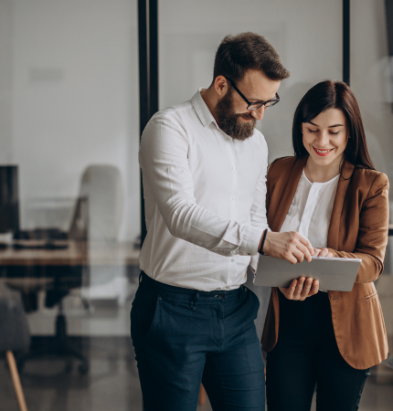 two people looking at a tablet