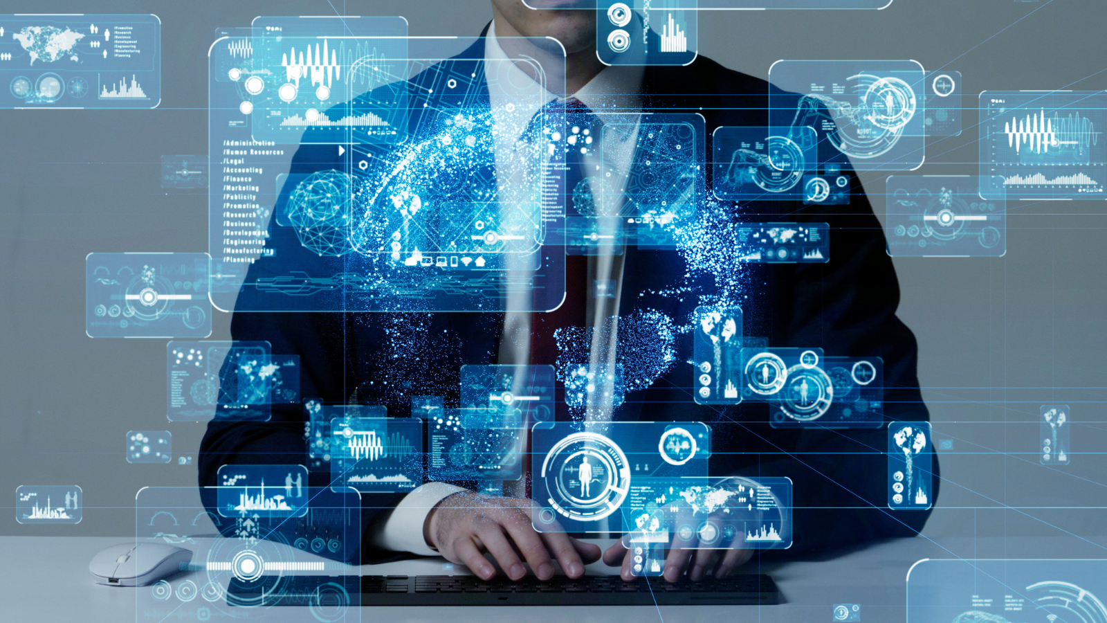 Image of man sitting in front of keyboard with abstract images of data and technology.