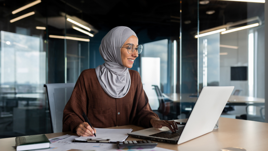Photo of business woman working on laptop. Photo of business woman working on laptop.